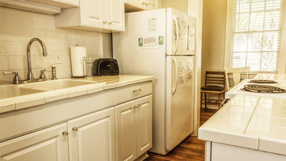 Kitchen - Designed with efficiency in mind, the kitchen maximizes its footprint and blends seamlessly into the cottage’s open living space.