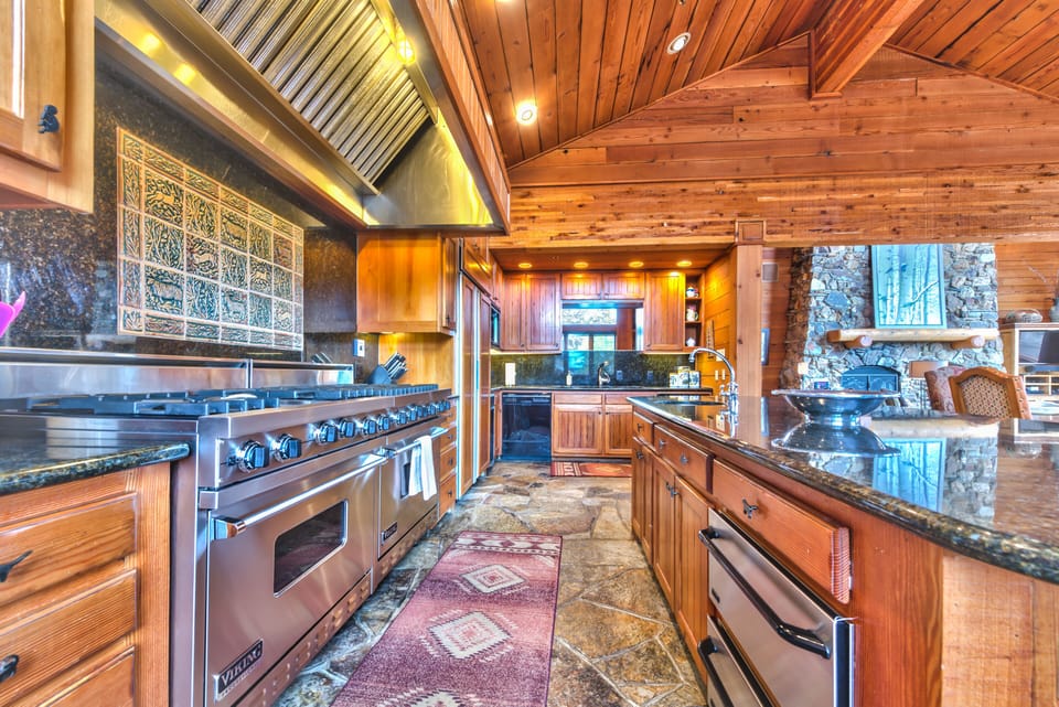 Fully Equipped Chef's Kitchen with Viking Appliances, Granite Countertops, and Bar Seating for 4