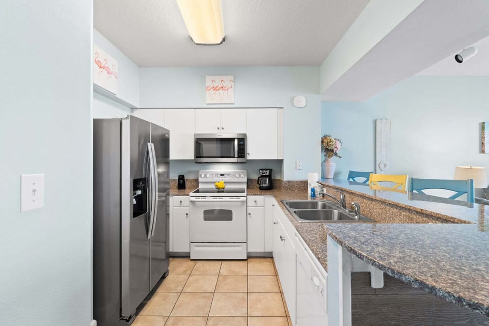 Fully Stocked Kitchen with Bar Seating