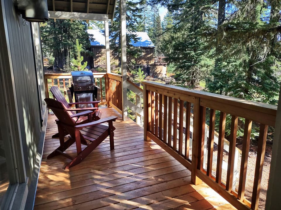 Barlow Cabin Deck - back deck of home with access to the house. BBQ and outdoor seating is available.