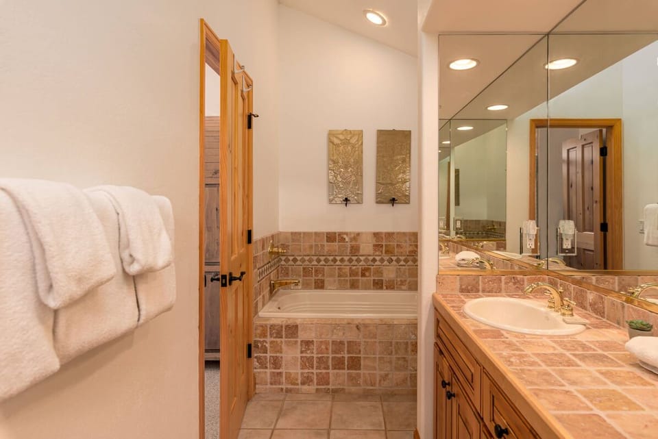 Separate tub in the ensuite bathroom