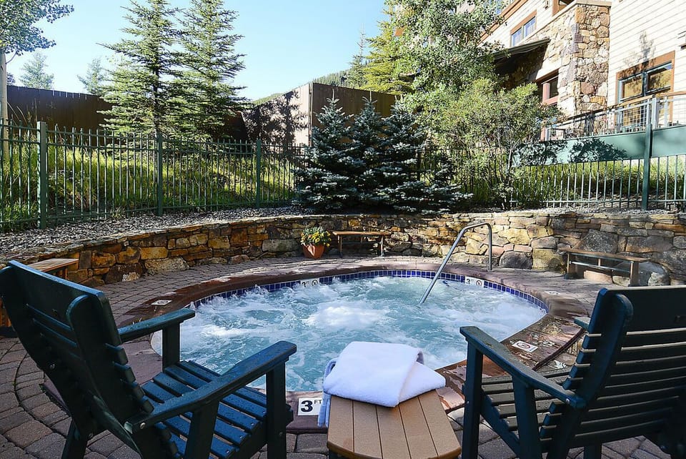Relax in one of the bubbling hot tubs at Zephyr Mountain Lodge