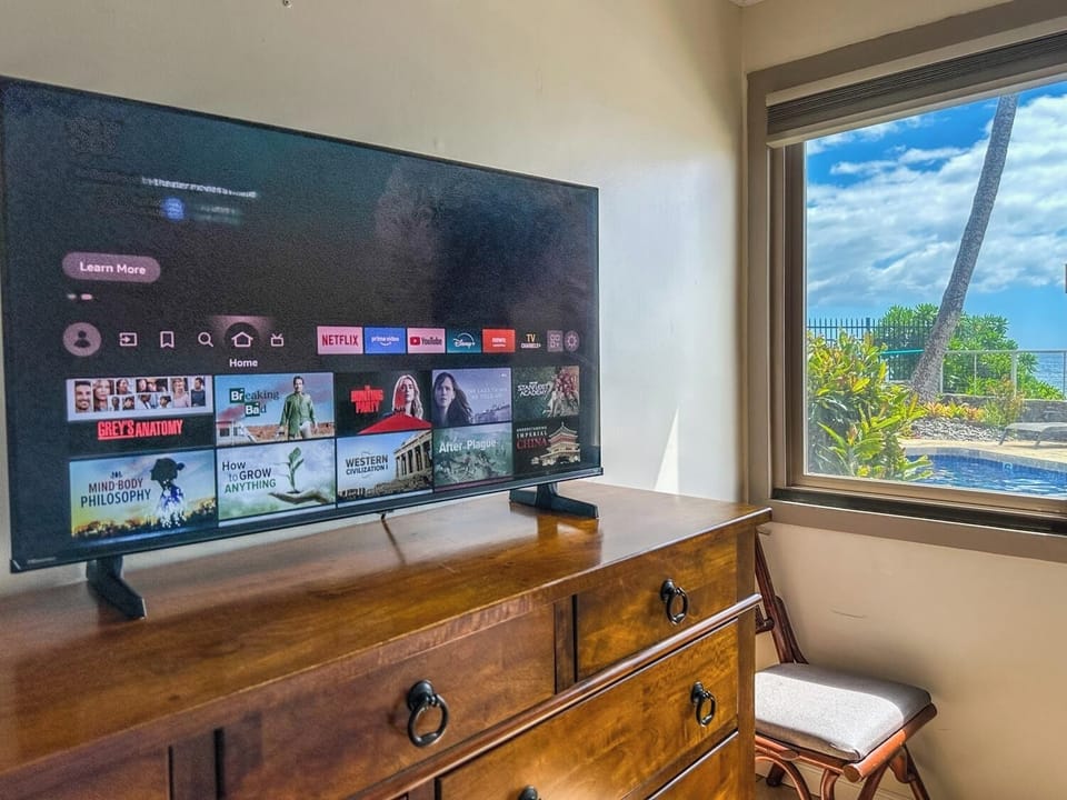 TV with streaming services in the master bedroom.