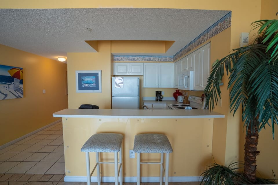 Kitchen with two stools at the breakfast bar.