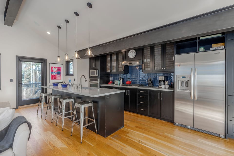 Newly Remodeled Gourmet Kitchen with Stainless Steel Appliances, Stone Counters, Bar Seating for 4