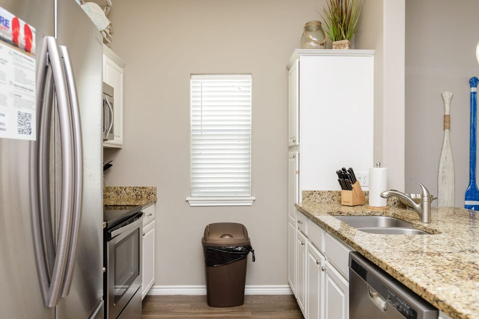 Your fully equipped kitchen awaits with granite countertops, stainless steel appliances, and everything you need to create memorable meals during your stay.
