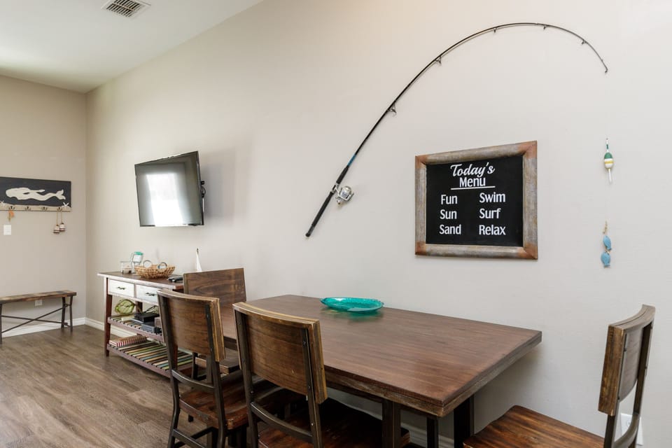 Gather around your stylish dining table where beach-themed décor and a fun daily menu board set the perfect tone for memorable meals together.