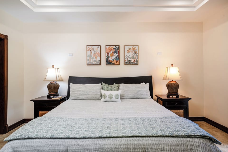 Langosta Beach oceanfront master suite with king size bed, tropical accents, and serene coastal ambiance. Oceanview condo in Guanacaste, Costa Rica combines luxury, comfort, and seaside relaxation for unforgettable Tamarindo vacations.