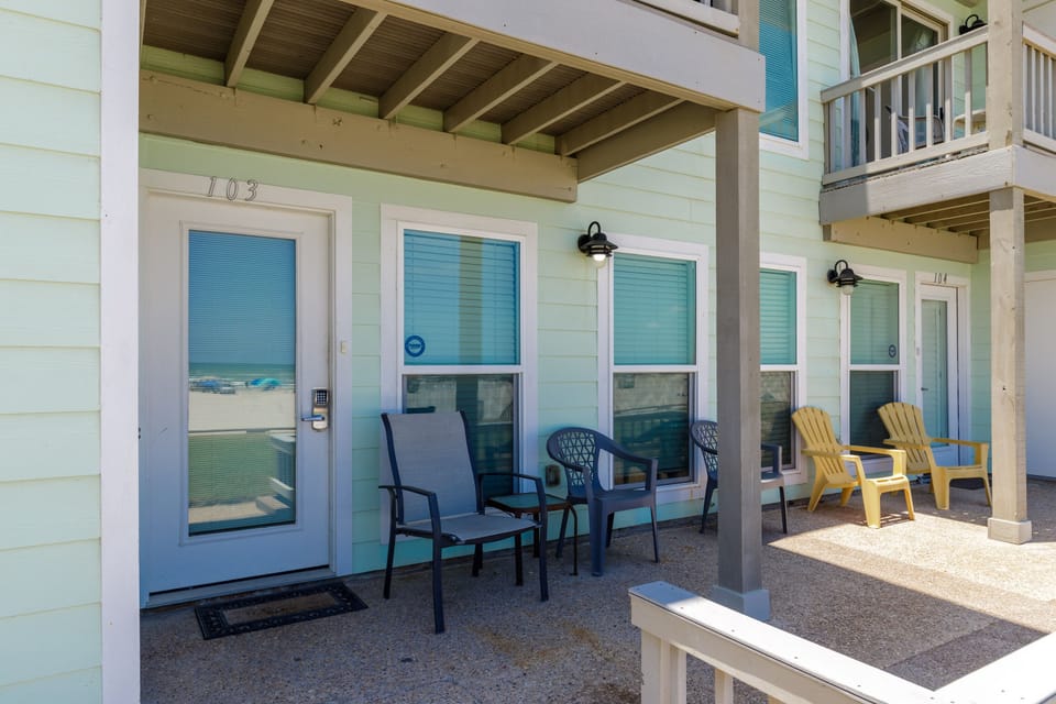 Relax on your private covered patio while watching all the beach-goers.