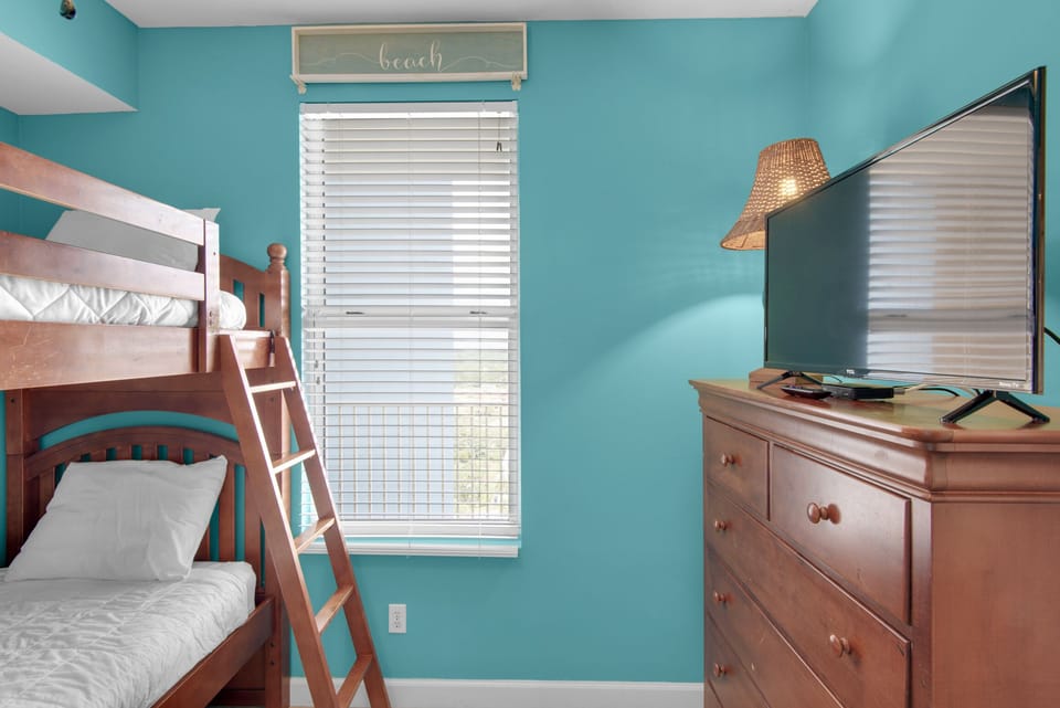 Bunk room with flat screen TV