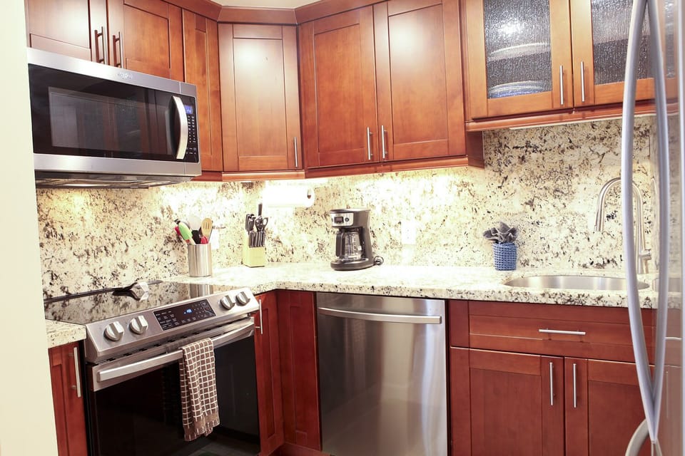 A10 Kihei Sands Beachfront Condominiums - Kitchen with stainless steel appliances.