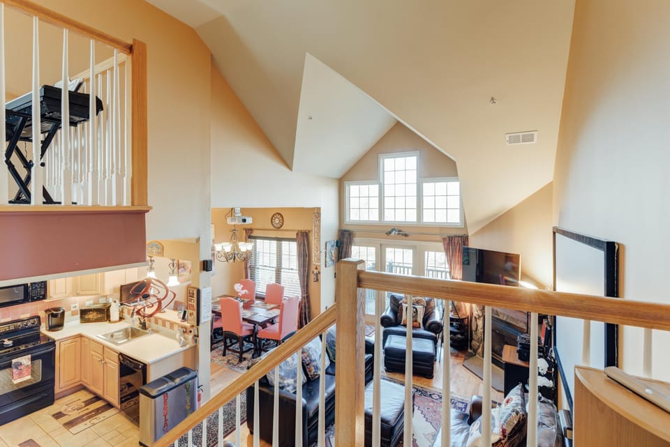 Spacious open-concept living area with soaring ceilings and natural light