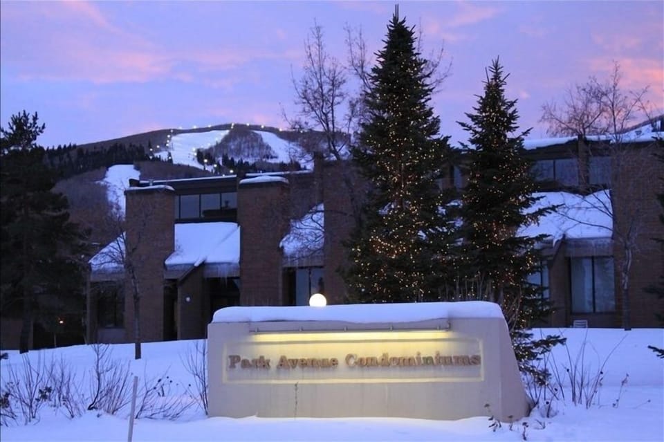 Outside of Park Avenue Condos with a view of the Park City Ski Slopes behind