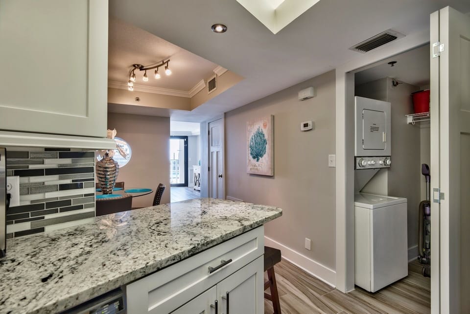 Laundry room with stacked washer dryer