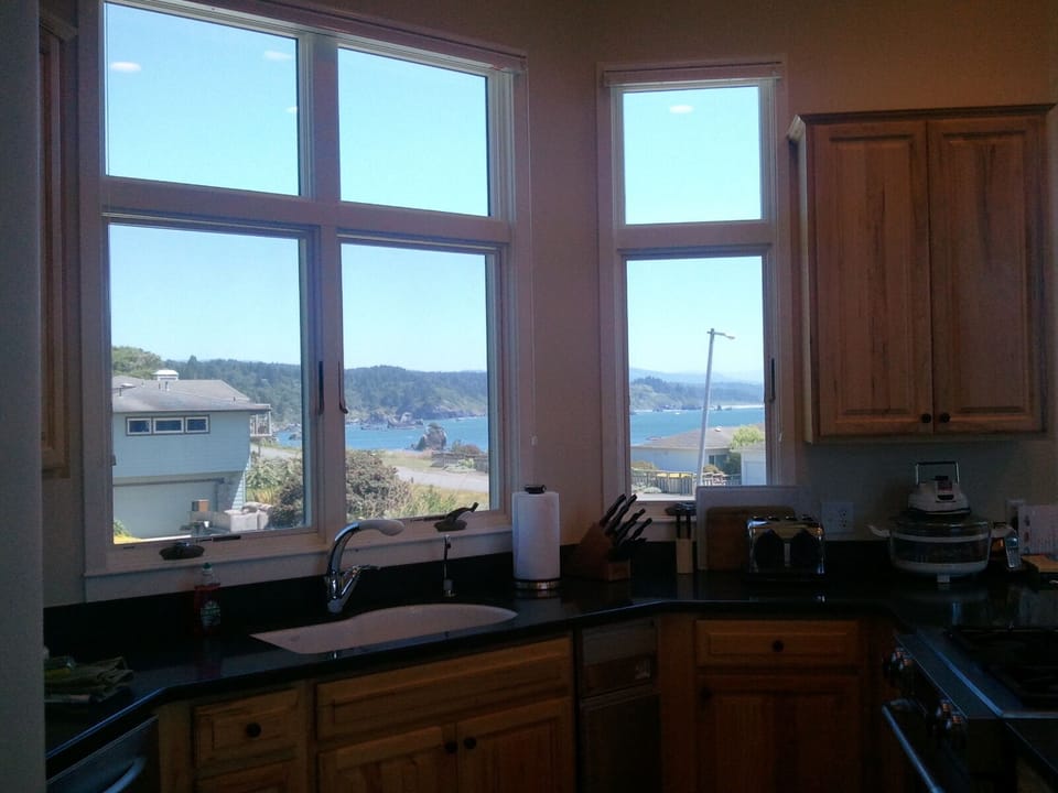 The kitchen has spectacular views of the harbor. - Cook meals and enjoy views of harbor.