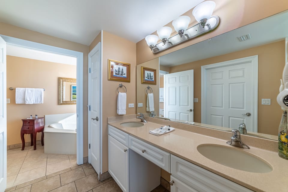 Parrothead Paradise Master Bath has a separate dressing area with double sinks and a huge walk in closet.