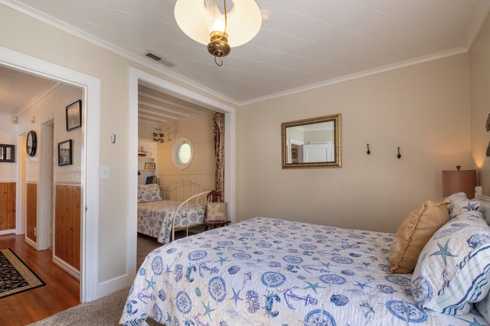 1st floor bedroom - This is a queen bedroom with captain bed and day bed area, curtain for privacy