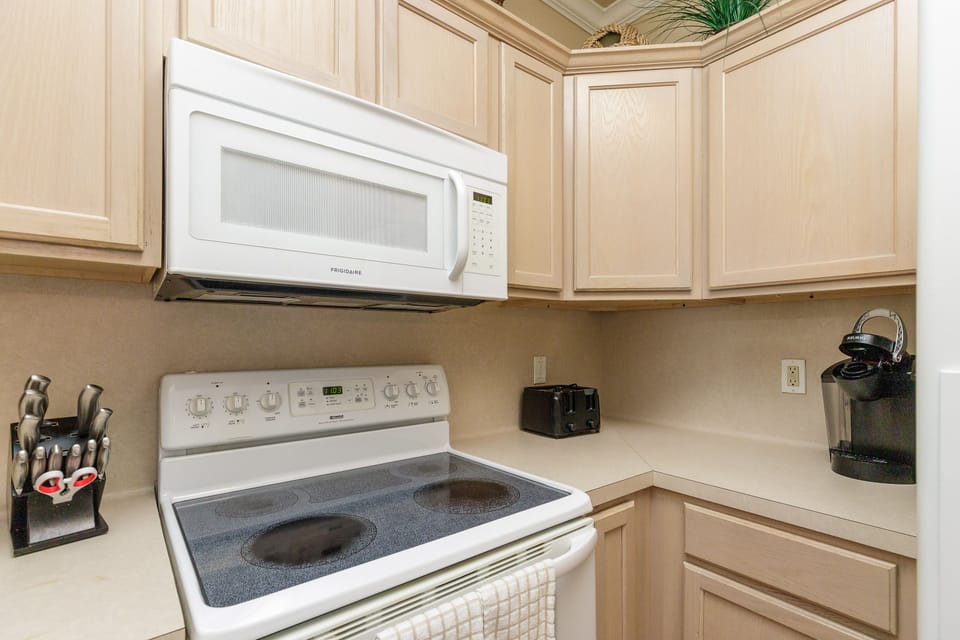 Your fully equipped kitchen features everything you need for home-cooked meals, from the convenient microwave to essential appliances and cookware.