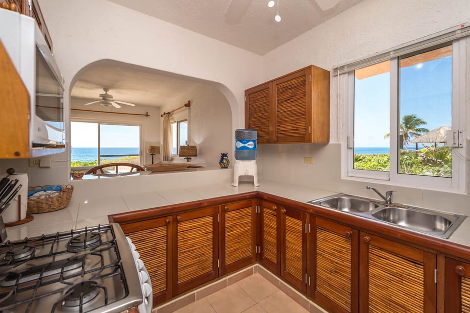 Casa Del Mar Akumal Mexico vacation home rental - Full kitchen with stove and oven, microwave, purified water and refrigerator.  Coffee maker, blender and toaster.