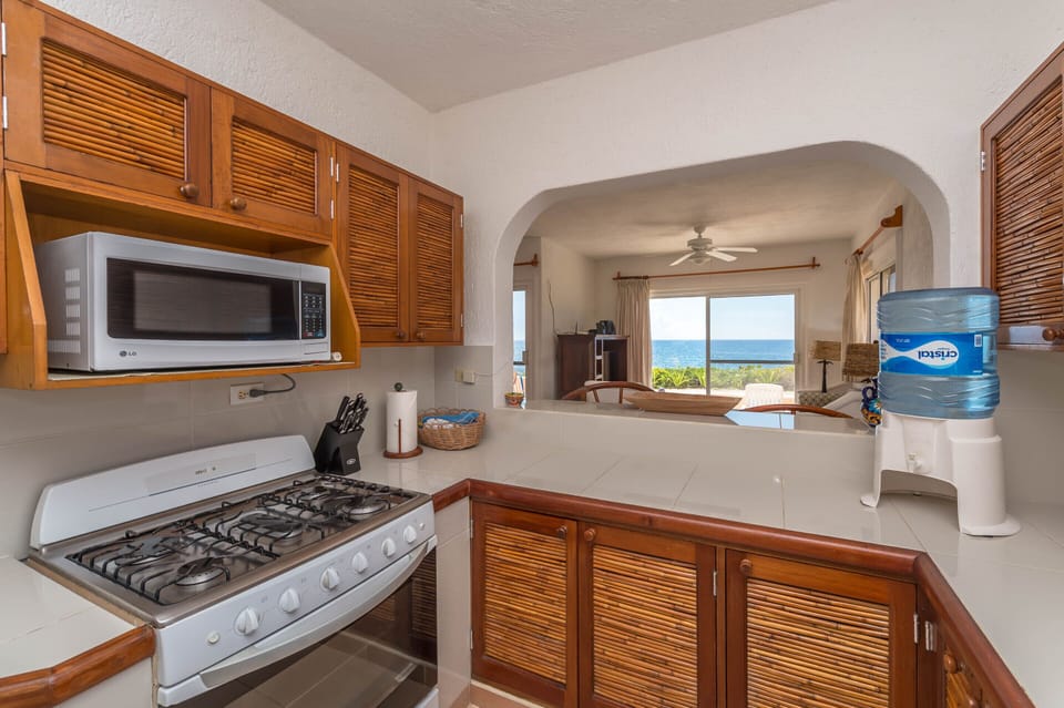 Casa Del Mar Akumal Mexico vacation home rental - Full kitchen with stove and oven, microwave, purified water and refrigerator.  Coffee maker, blender and toaster.