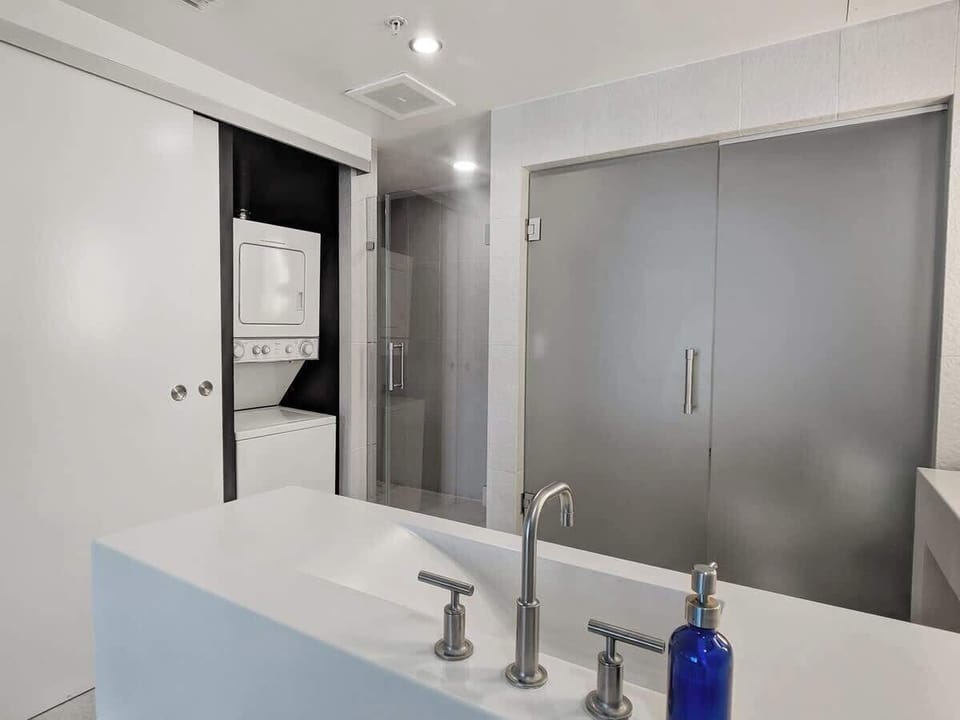 Master bathroom  with stackable washer/dryer