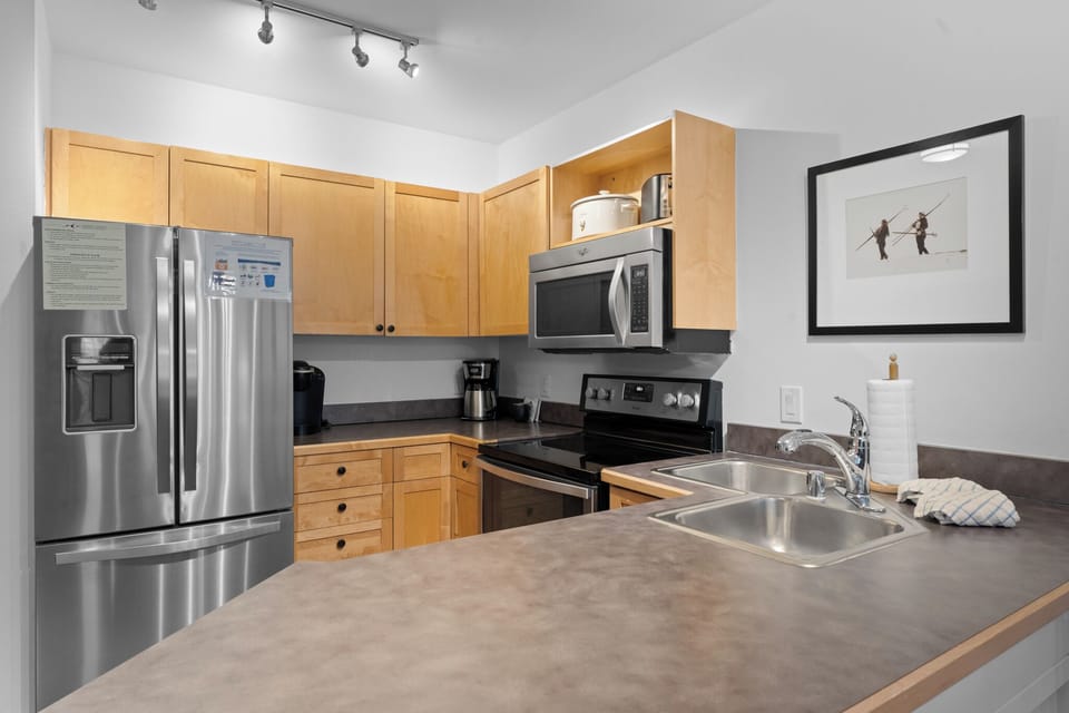 Your fully equipped kitchen features stainless steel appliances and ample counter space for preparing meals during your stay.