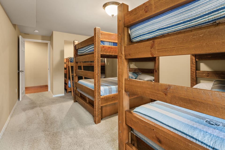 Aspen Lodge and Guest Cottage - Bunk room in the lower floor of the main house. Two sets of Full over Full Bunk Beds and one Queen over Queen Bunk.