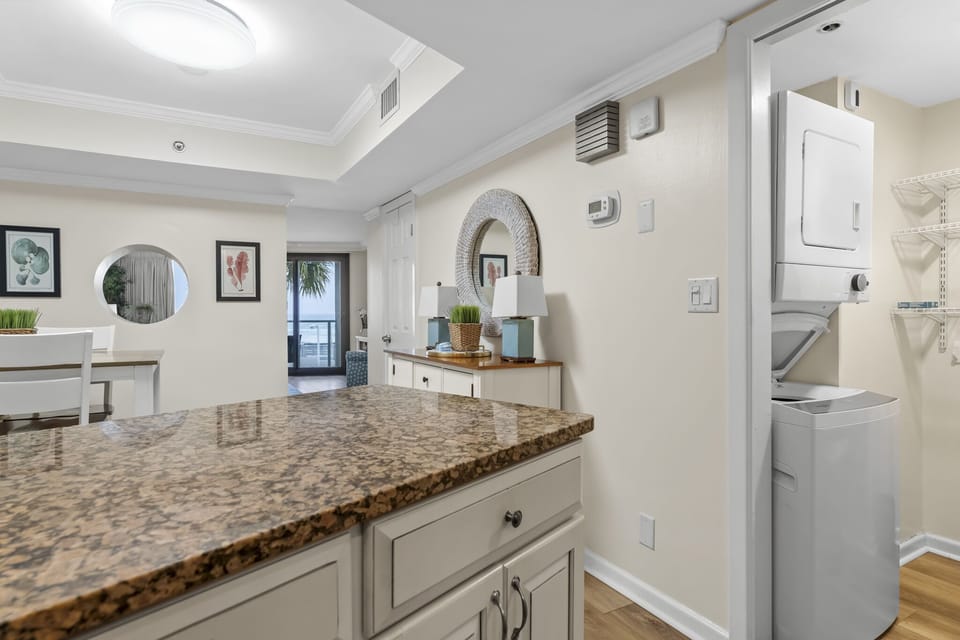 kitchen showing laundry room next to kitchen entrance