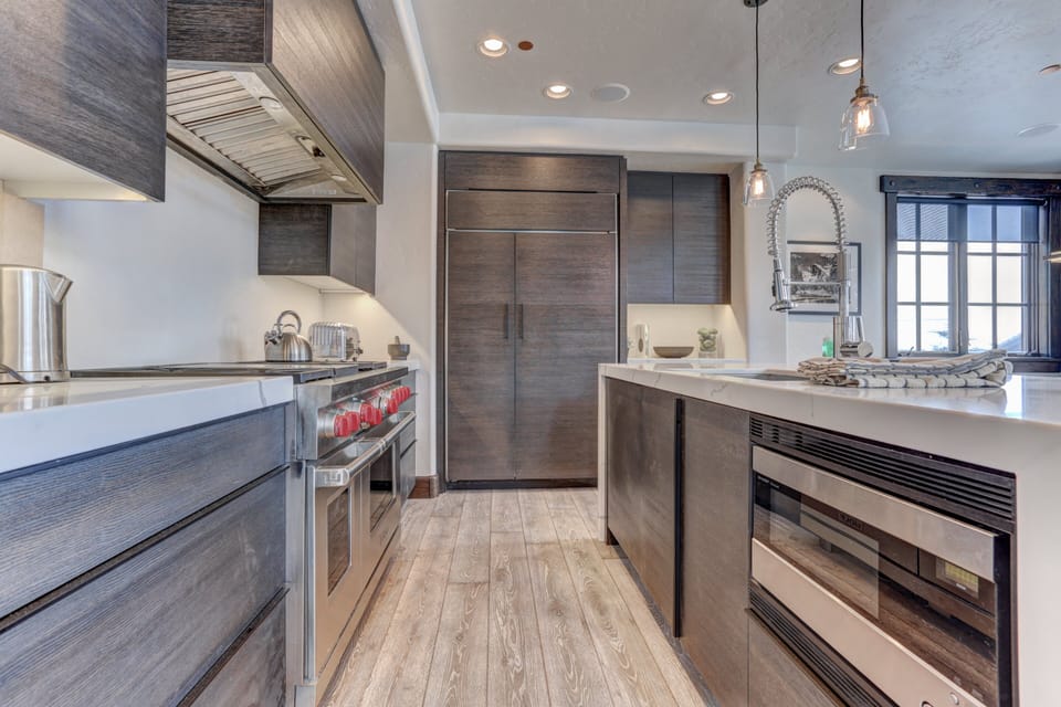 Modern Kitchen with Marble Counter Tops, Wolf Appliances and Sonos Sound