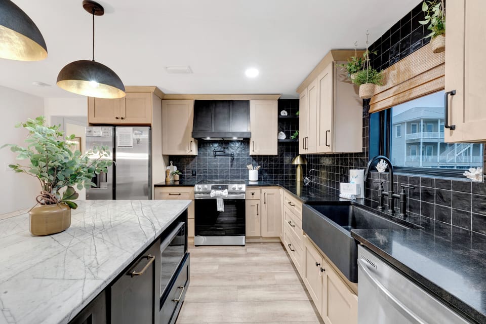 Stone counters and stainless appliances throughout