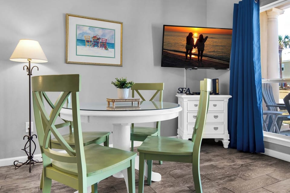 The dining table has seating for four