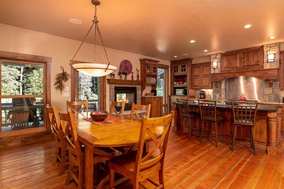 Dining room table seats eight + three at the breakfast bar