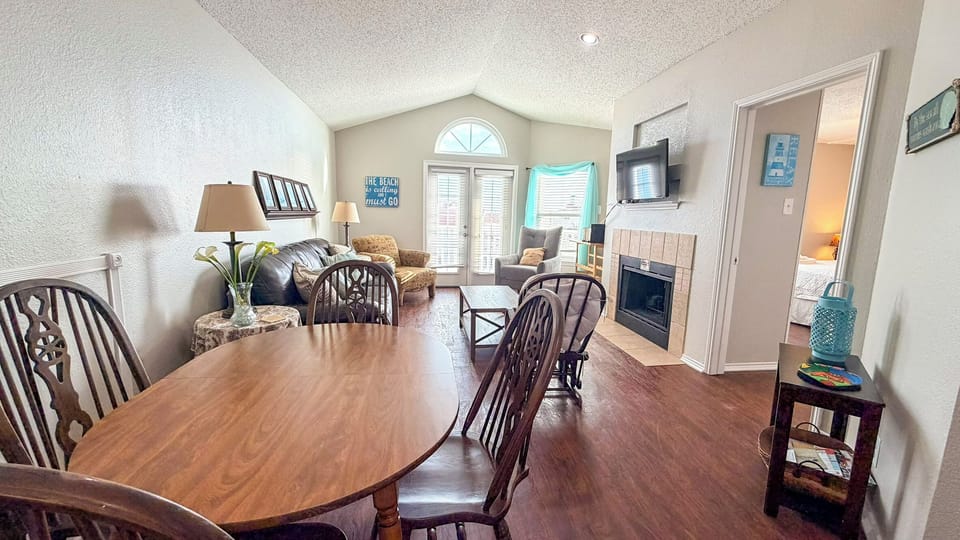 Your open-concept living space invites you to relax with cozy seating, a warm fireplace, and dining area perfect for memorable meals together.