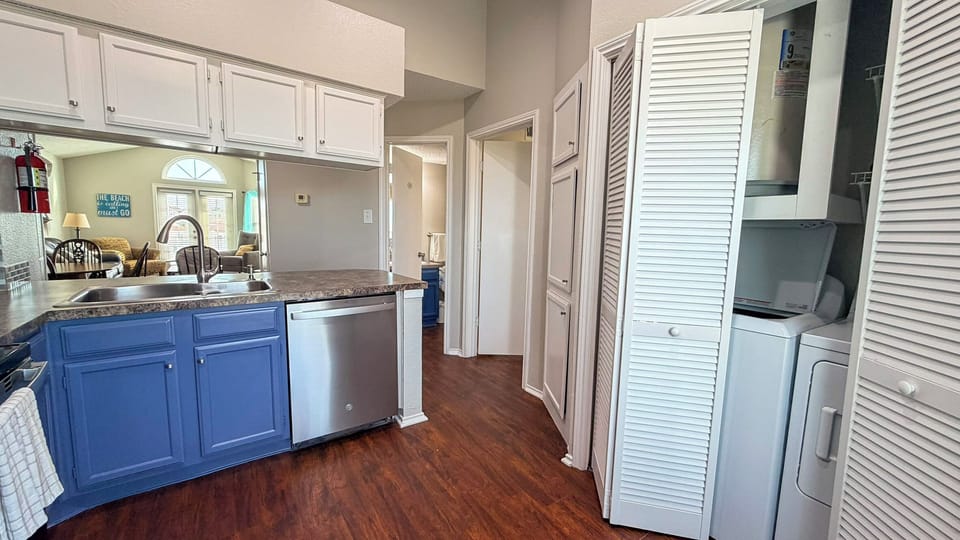 Your fully equipped kitchen features granite countertops, stainless appliances, and convenient in-unit laundry facilities for a comfortable home-away-from-home experience.