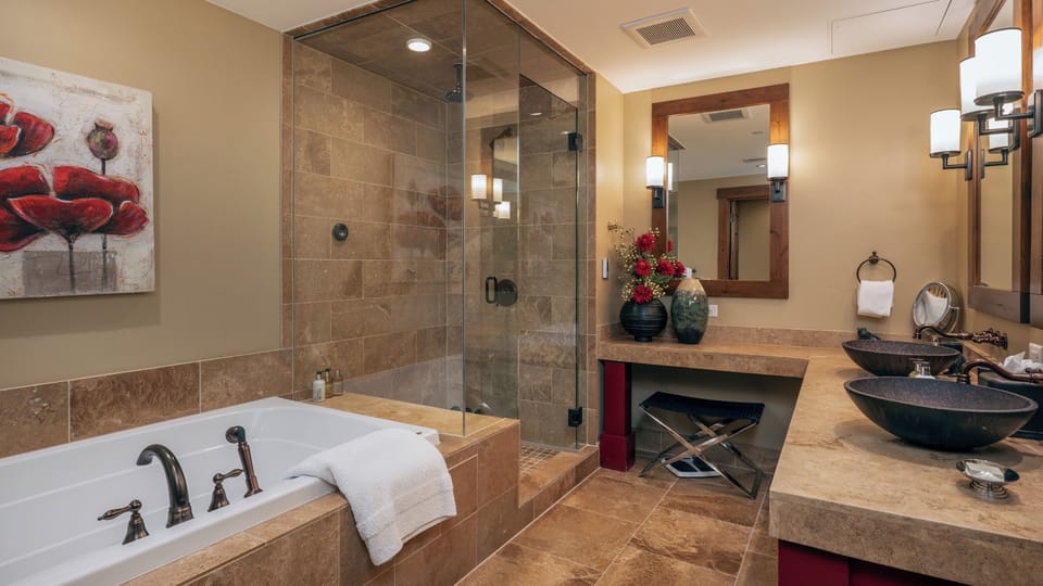 Bedroom 1, Main Level - Primary ensuite with soaking tub and walk-in shower