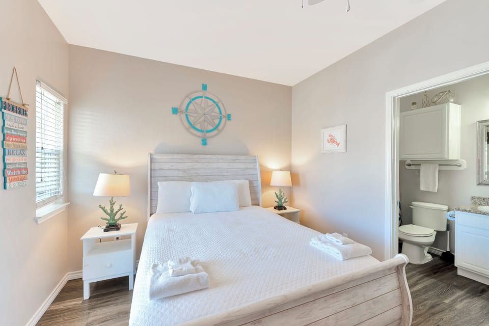 Drift off to sleep in your cozy coastal-themed bedroom with soft linens and charming nautical touches that create a peaceful seaside retreat.