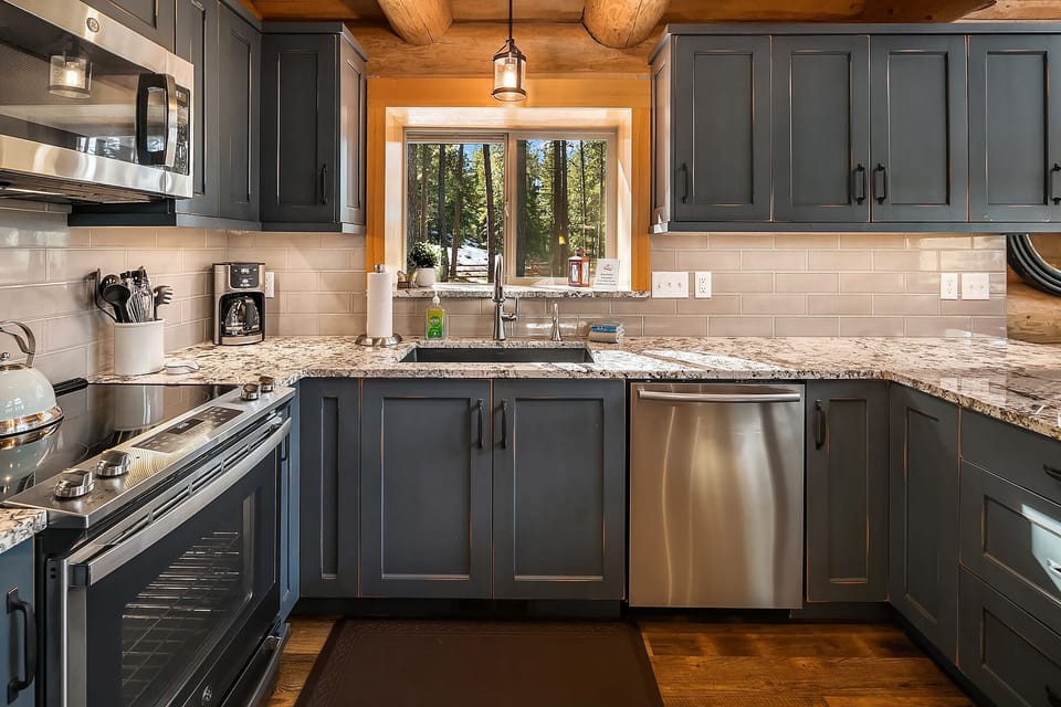 Tall Pines: - Stainless appliances and views of the forest out the kitchen window.