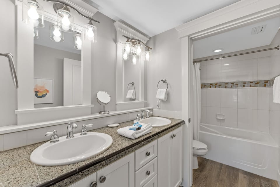 Vanity Area with Dual Sinks and Great Lighting