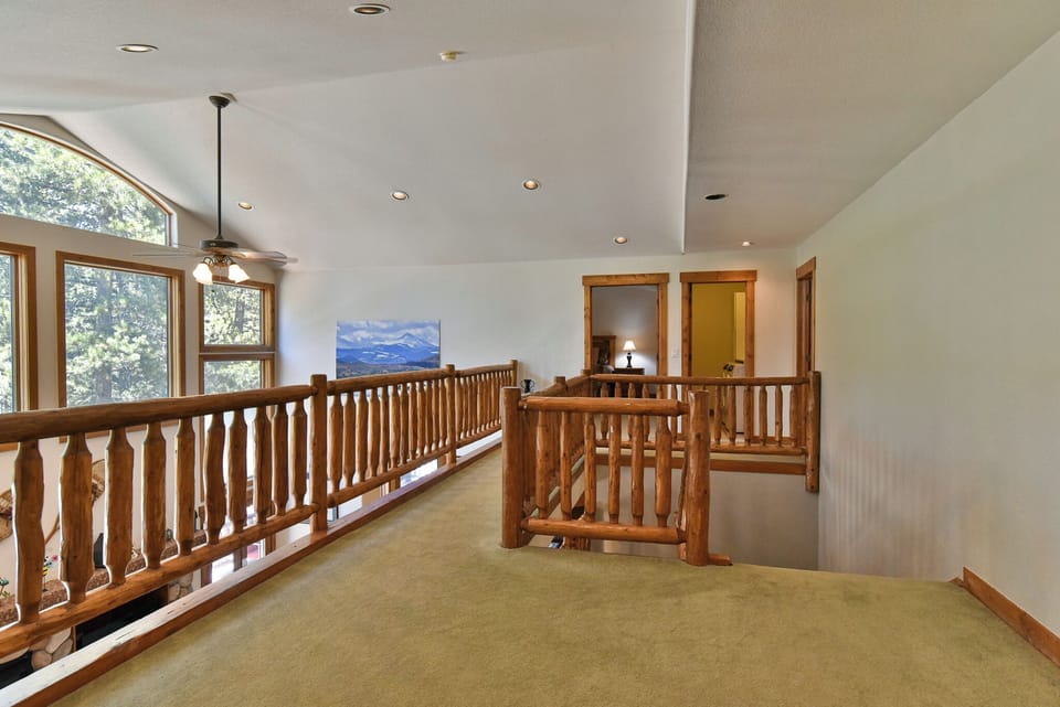 Second Level Hallway - Hallway at the top of the staircase, facing the master suite and suite 2.