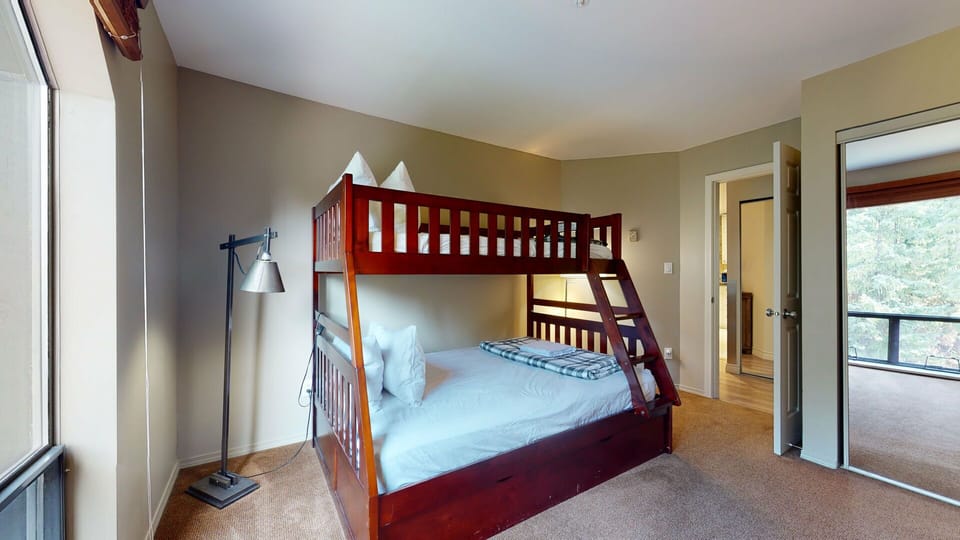 The second bedroom comfortably sleeps up to four with versatile bunk arrangements.
