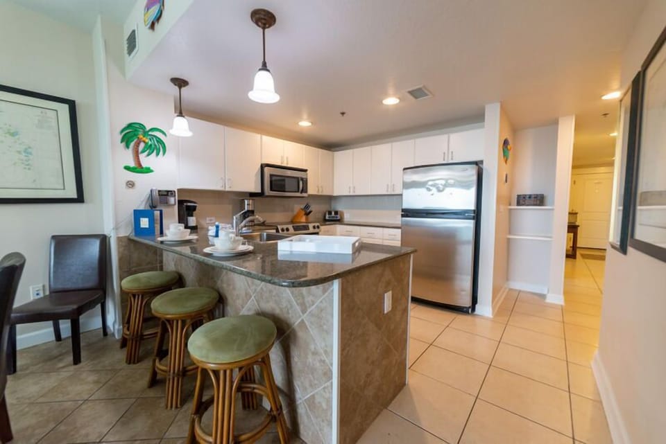 Stainless steel appliances & a keurig are conveniently located in the kitchen