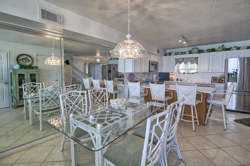 Dining area with extra bar top seating. 