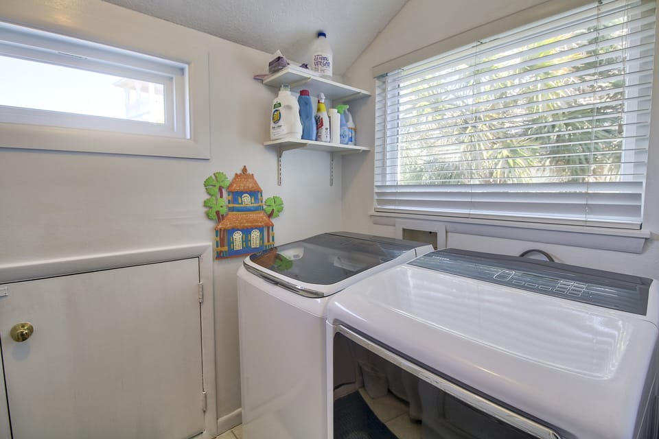 Second level washer and dryer laundry room off guest bedroom. 