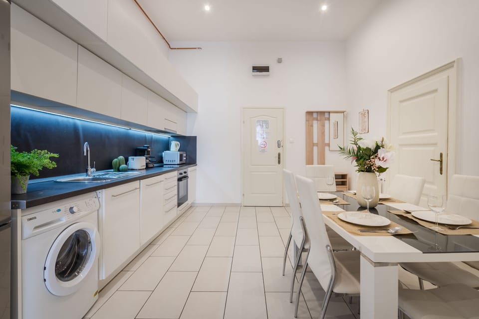 Executive Apartment | Private kitchen | Fridge, highchair, dining tables
