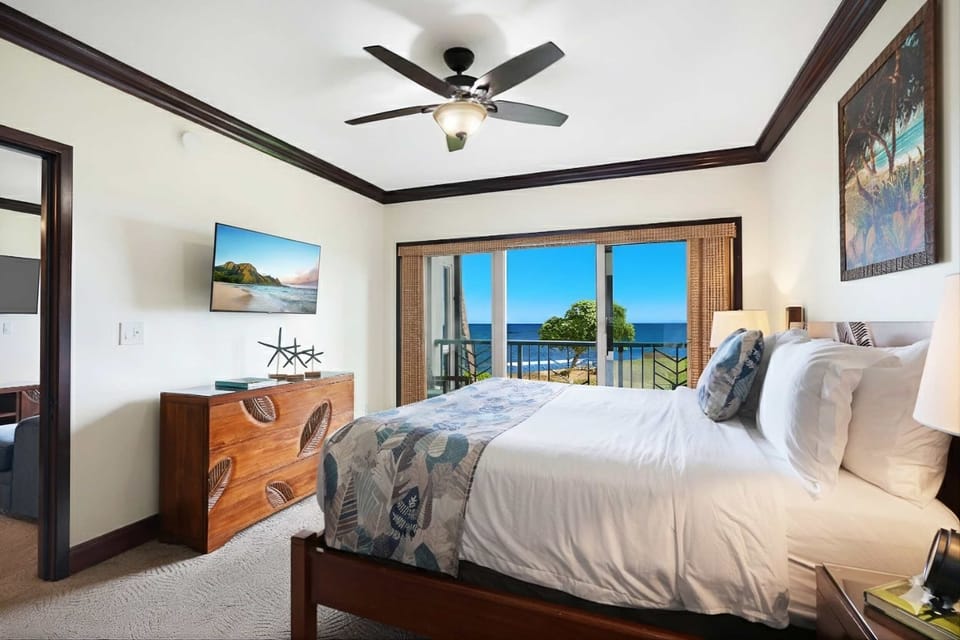 Peaceful oceanfront bedroom with premium linens & island charm
