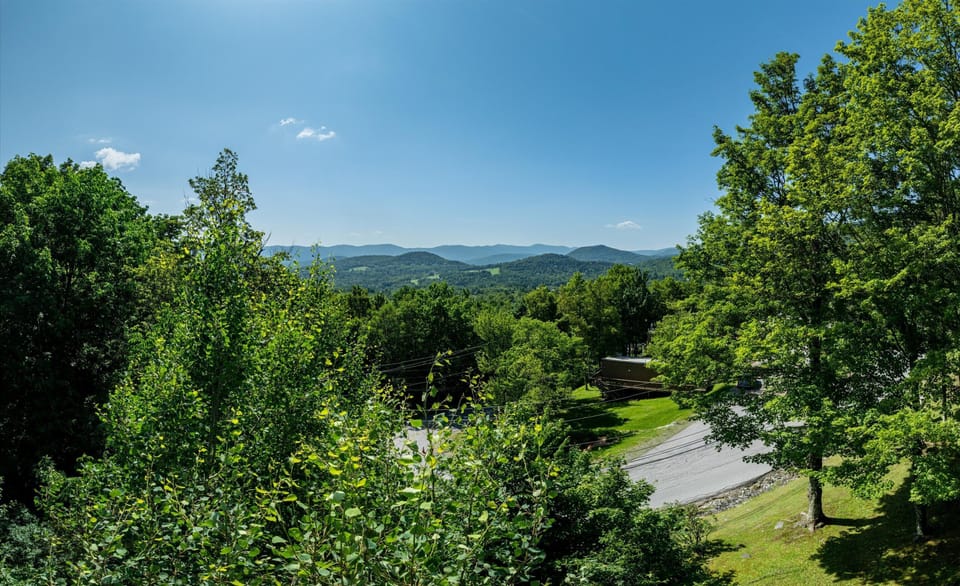 - Panoramic mountain views with rolling hills and sky   - Stunning White Mountain scenery surrounds your stay   - Perfect backdrop for relaxation and outdoor exploring