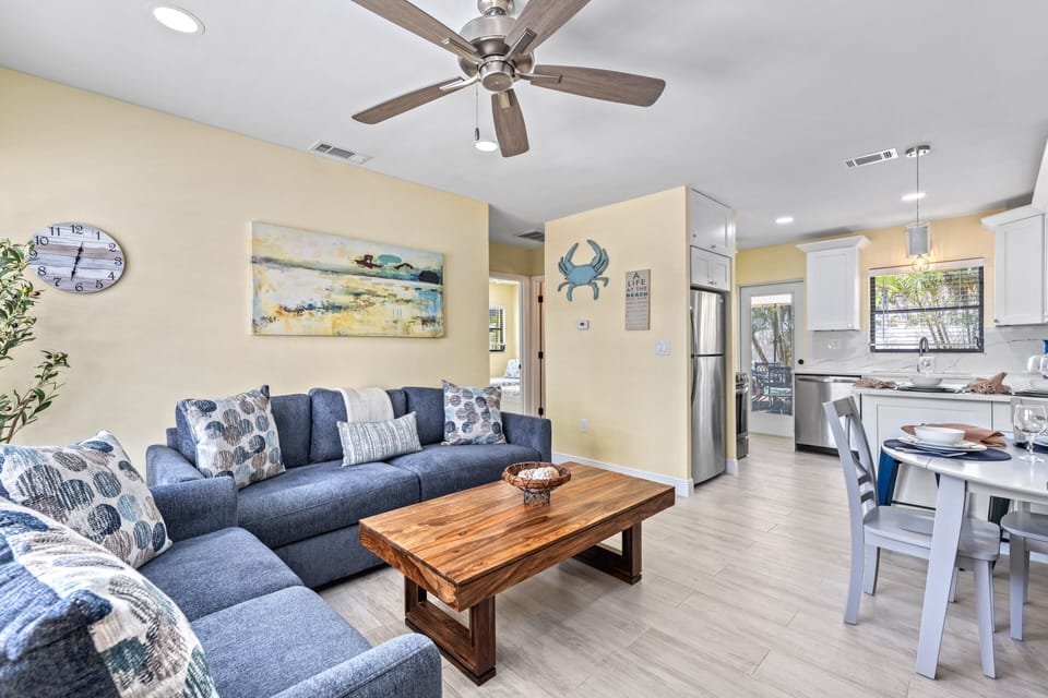 Open the door to a bright, airy space where the kitchen, dining, and living areas blend seamlessly for easy family living.