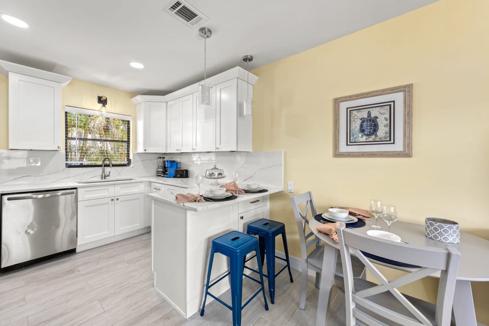 Start your mornings at the cheerful breakfast bar or gather around the dining table for cozy meals with family and friends.