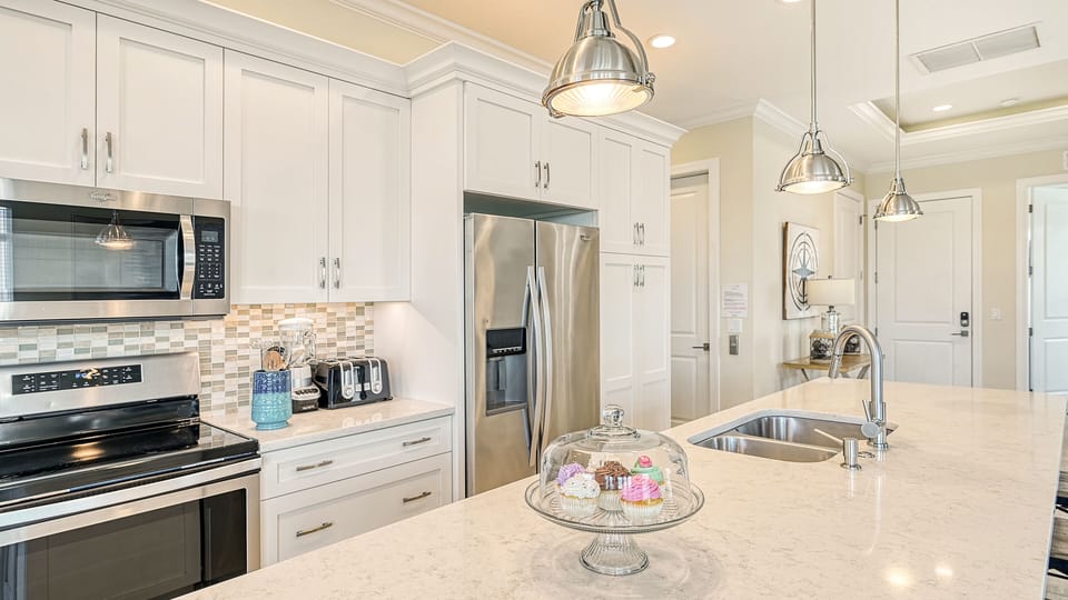 Whip up culinary delights on sleek countertops —a gourmet kitchen made for both chefs and storytellers.
