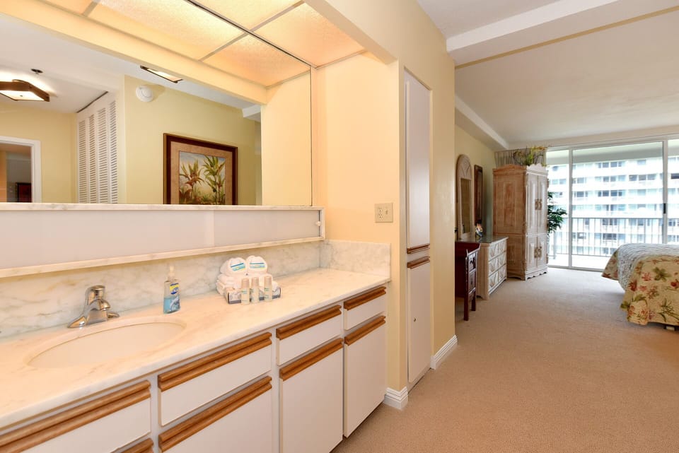 Large well-lit vanity area in the en-suite bathroom